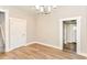 Bright living room with hardwood floors and neutral paint that connects to the entryway at 1115 N Keystone Ave, Indianapolis, IN 46201