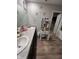 Bathroom featuring dual sinks, a large vanity, and modern fixtures at 11204 Sashing Way, Monrovia, IN 46157
