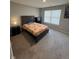 Bedroom featuring neutral color palette, a large window, and modern furnishings at 11204 Sashing Way, Monrovia, IN 46157