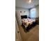 Bedroom with queen bed with designed bedding, carpet floor and door entrance at 11204 Sashing Way, Monrovia, IN 46157