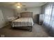 A spacious bedroom featuring a large bed, a crib, and plenty of natural light at 11204 Sashing Way, Monrovia, IN 46157