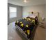 Bedroom featuring neutral color palette, a large window, and modern furnishings at 11204 Sashing Way, Monrovia, IN 46157