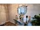 A charming entryway with decorative mirror, table and plants adding a personal touch at 11204 Sashing Way, Monrovia, IN 46157