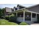 Building with a brick facade and covered porch with white railings and columns at 11204 Sashing Way, Monrovia, IN 46157
