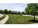 Brick building with an American flag surrounded by green grass and manicured bushes at 11204 Sashing Way, Monrovia, IN 46157