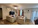 Cozy living room with modern furniture, stylish decor, and a contemporary chandelier at 11204 Sashing Way, Monrovia, IN 46157