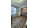 Spacious office space with a workstation, neutral walls, blinds, and unique beaded doorway at 11204 Sashing Way, Monrovia, IN 46157
