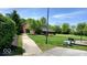 Park area with a covered barn-style building and playground surrounded by greenery and trees at 11204 Sashing Way, Monrovia, IN 46157