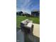 Outdoor patio with comfortable seating overlooking a green lawn and neighboring houses at 11204 Sashing Way, Monrovia, IN 46157