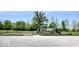 Playground area with play equipment and a swing set surrounded by greenery at 11204 Sashing Way, Monrovia, IN 46157