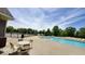 Outdoor pool area with lounge chairs, tables, and chairs surrounding the pool at 11204 Sashing Way, Monrovia, IN 46157