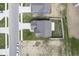 A birds eye view displays a new home with a grey roof, a long driveway, and a partially fenced backyard at 1181 Galaxy Ln, Danville, IN 46122