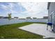 Private backyard with a well-maintained lawn, patio, and a white fence at 1181 Galaxy Ln, Danville, IN 46122