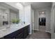 Bathroom features a dual sink vanity with a large mirror and walk-in closet at 1181 Galaxy Ln, Danville, IN 46122