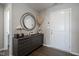 A welcoming entryway with wood floors, stylish decor, and a view into a powder room at 1181 Galaxy Ln, Danville, IN 46122