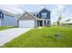 Charming two-story home with a well-manicured lawn and inviting curb appeal at 1181 Galaxy Ln, Danville, IN 46122
