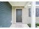 Close-up of a front door with brick and siding, offering a welcoming entrance to the home at 1181 Galaxy Ln, Danville, IN 46122