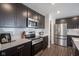 Modern kitchen features stainless steel appliances, ample counter space, and stylish cabinets at 1181 Galaxy Ln, Danville, IN 46122