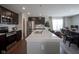 Modern kitchen with stainless steel appliances, quartz countertops, and a spacious island at 1181 Galaxy Ln, Danville, IN 46122