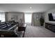 Comfortable living room featuring large windows, plush seating, and a decorative fireplace at 1181 Galaxy Ln, Danville, IN 46122
