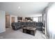 Open-concept living space with island, stainless steel appliances, and comfortable leather seating at 1181 Galaxy Ln, Danville, IN 46122