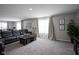 Inviting living room with large windows, plush seating, and stylish decor at 1181 Galaxy Ln, Danville, IN 46122