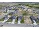 A high-angle shows a suburban neighborhood with neatly arranged houses and freshly laid lawns at 1181 Galaxy Ln, Danville, IN 46122