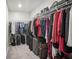 Walk-in closet offering ample storage with wire racks for hanging clothes and shelving for luggage at 1181 Galaxy Ln, Danville, IN 46122