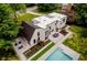 Modern home with a pool, patio, and landscaped yard, viewed from above at 11911 Eden Glen Dr, Carmel, IN 46033