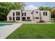Modern home exterior with pool, patio, and lush backyard at 11911 Eden Glen Dr, Carmel, IN 46033