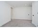 Neutral bedroom featuring carpet, minimalist design and access to an ensuite bathroom at 11911 Eden Glen Dr, Carmel, IN 46033