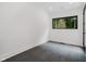 Bright bedroom with a large window offering backyard views and tiled flooring at 11911 Eden Glen Dr, Carmel, IN 46033