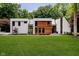Modern two-story home featuring a beautifully landscaped lawn and mixed material exterior at 11911 Eden Glen Dr, Carmel, IN 46033