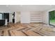 Open-concept living room with large windows, herringbone floors, and an open layout at 11911 Eden Glen Dr, Carmel, IN 46033