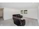 Finished basement living room featuring plush carpeting, recessed lighting, and natural light at 11911 Eden Glen Dr, Carmel, IN 46033