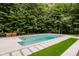 Large in-ground pool featuring a modern design with ample space for entertaining at 11911 Eden Glen Dr, Carmel, IN 46033