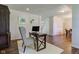 Home office features a dark wood desk, upholstered chair, and hardwood floors with natural light at 1238 Aggie Ln, Indianapolis, IN 46260