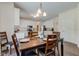 Kitchen and dining area with hardwood floors, stainless appliances, and white cabinetry at 1238 Aggie Ln, Indianapolis, IN 46260