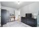 Bedroom featuring a black dresser, makeup vanity, and patterned rug on hardwood floors at 1245 Kessler Blvd E Dr, Indianapolis, IN 46220
