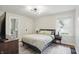 Comfortable bedroom features a decorative light fixture and neutral tones at 1245 Kessler Blvd E Dr, Indianapolis, IN 46220