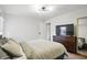Neutral bedroom features ample closet space, dresser, and large format TV at 1245 Kessler Blvd E Dr, Indianapolis, IN 46220