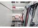 Spacious walk-in closet with ample shelving, and multiple hanging racks at 1245 Kessler Blvd E Dr, Indianapolis, IN 46220