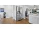 Stainless steel refrigerator blends seamlessly into this well appointed kitchen with hardwood floors at 1245 Kessler Blvd E Dr, Indianapolis, IN 46220