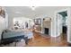 Bright living room showcasing an archway to the kitchen and a stone fireplace at 1245 Kessler Blvd E Dr, Indianapolis, IN 46220