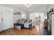 Open-concept living room and dining area featuring hardwood floors and modern furniture at 1245 Kessler Blvd E Dr, Indianapolis, IN 46220