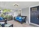 Inviting screened porch featuring comfortable seating and a stylish rug, perfect for relaxing outdoors at 1245 Kessler Blvd E Dr, Indianapolis, IN 46220