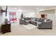 Finished basement with plush sectional sofa, recreation, and entertainment area at 13234 Amundson Dr, Carmel, IN 46074
