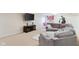 Cozy finished basement with sectional sofa, mounted television, and recreational games at 13234 Amundson Dr, Carmel, IN 46074