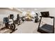 Home gym featuring various equipment, ample lighting, and rubber flooring at 13234 Amundson Dr, Carmel, IN 46074