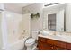 Bathroom featuring a shower-tub combo, a vanity with plants, and neutral finishes at 13234 Amundson Dr, Carmel, IN 46074